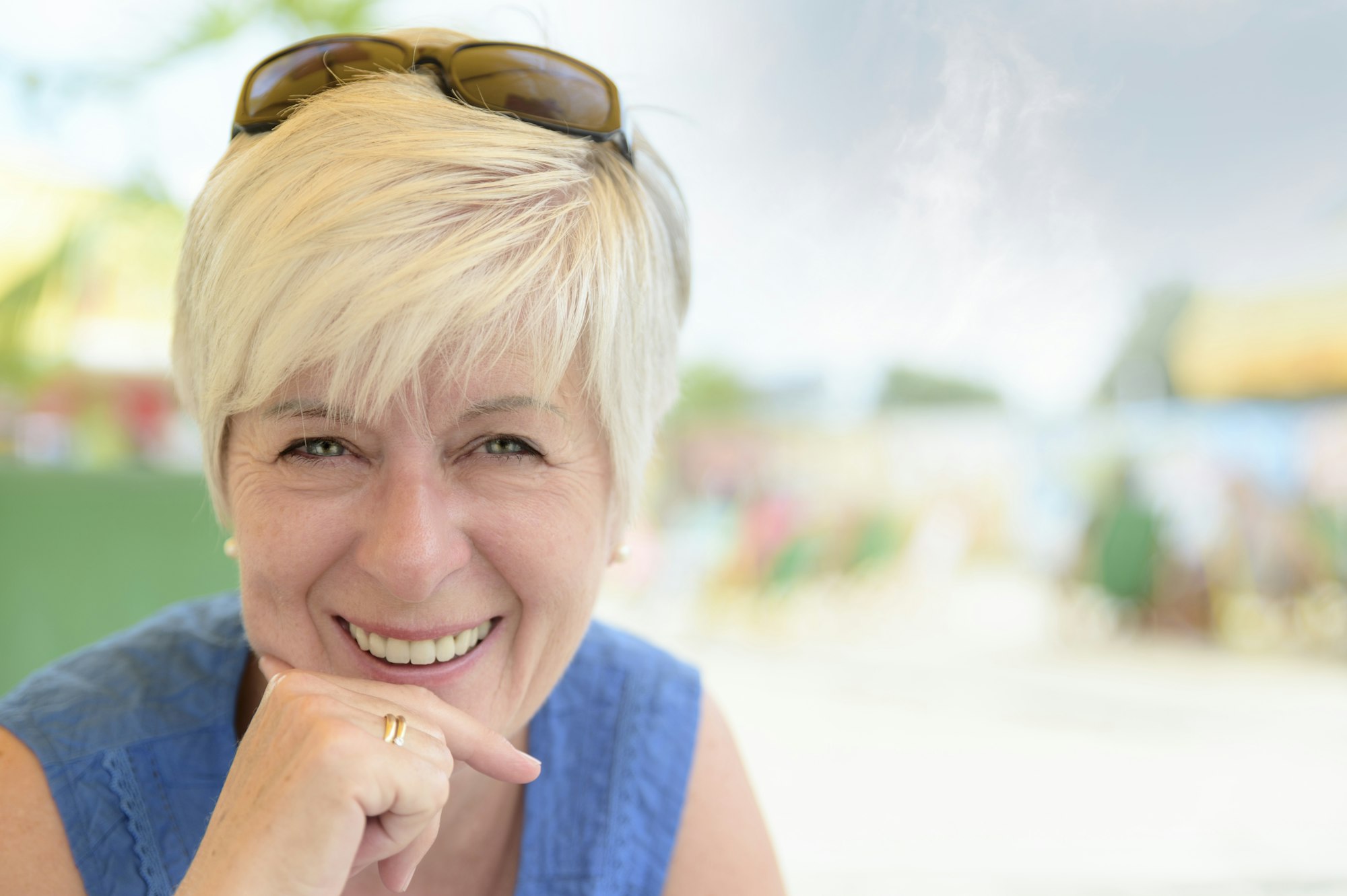 Portrait of smiling senior woman at beach bar